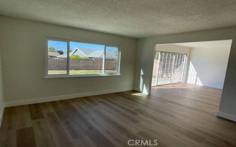 Another view from Living room into yard and dining area.