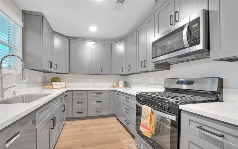 Brand New Kitchen: New Cabinetry, Quartz, Kohler Fixtures, Recessed lights, and New S/S Whirlpool appliances.