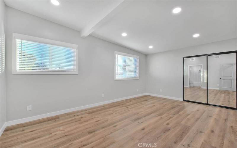 Primary Bedroom 1: New Dual Pane Windows, New Blinds, New Recessed Lights, New Mirror Closet Sliding Doors, New Laminate Waterproof flooring, New Baseboards.