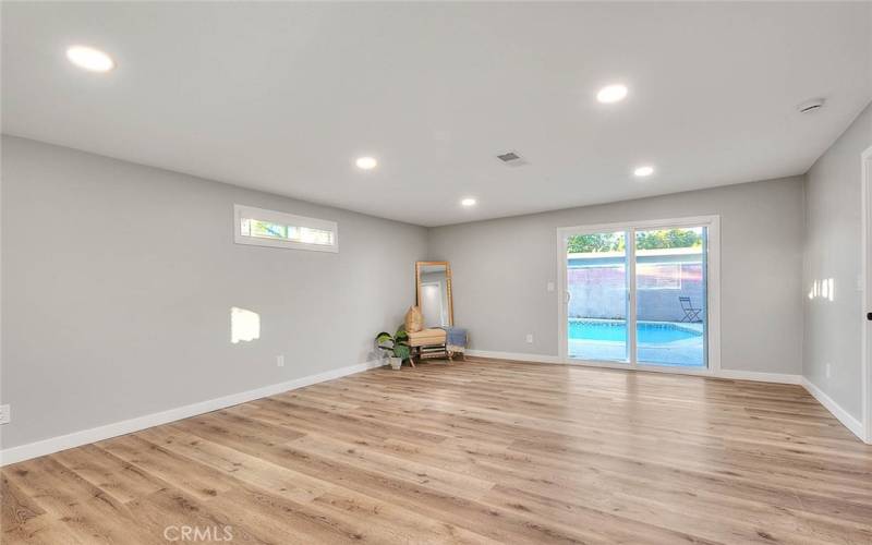 Bedroom 2: New Dual Pane Windows and Sliding Glass Door to Backyard, New Blinds, New Recessed Lights, New Laminate Waterproof flooring, New Baseboards.