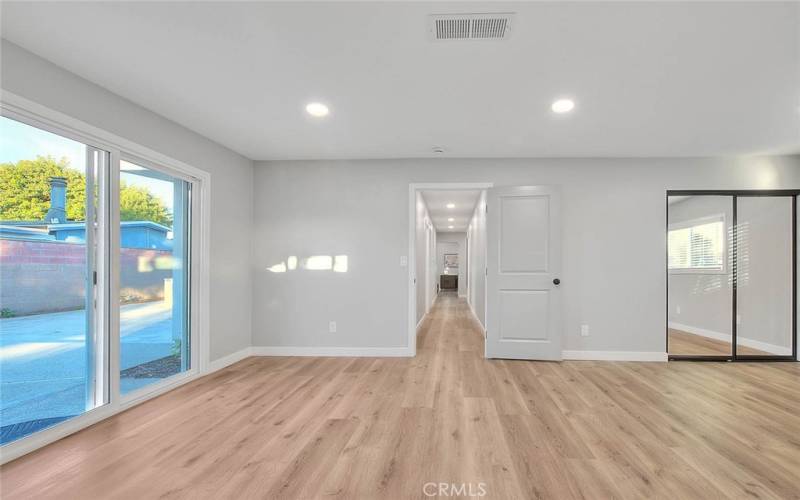 Bedroom 2: New Dual Pane Sliding Glass Door to Backyard, New Recessed Lights, New Mirror Closet Sliding Doors, New Laminate Waterproof flooring, New Baseboards. New Doors.