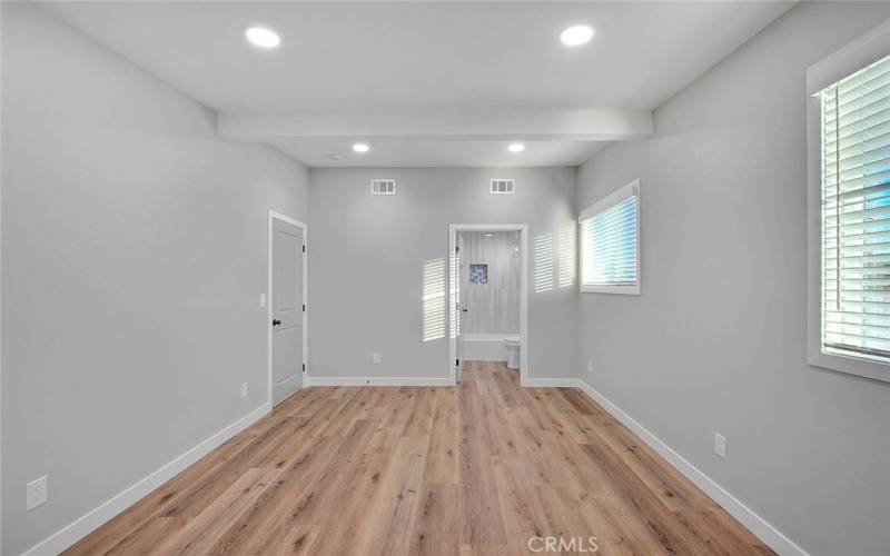 Primary Bedroom 1: New Dual Pane Windows, New Blinds, New Recessed Lights, New Laminate Waterproof flooring, New Baseboards.