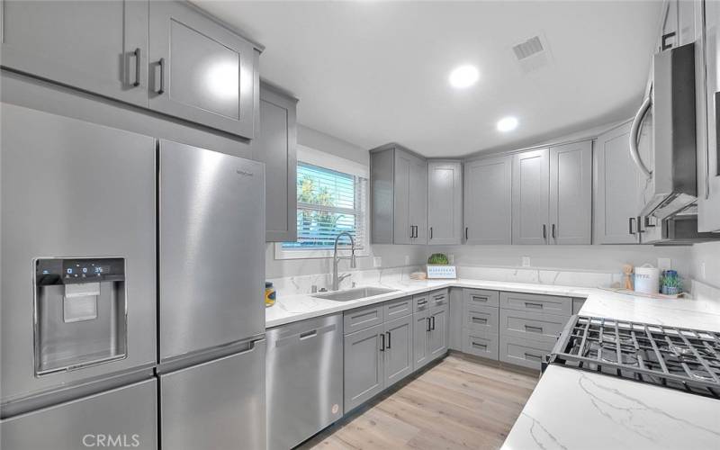 Brand New Kitchen: New Cabinetry, Quartz, Kohler Fixtures, Recessed lights, and New S/S Whirlpool appliances. 

Fridge, Stove, Microwave, and Dishwasher ALL Included.