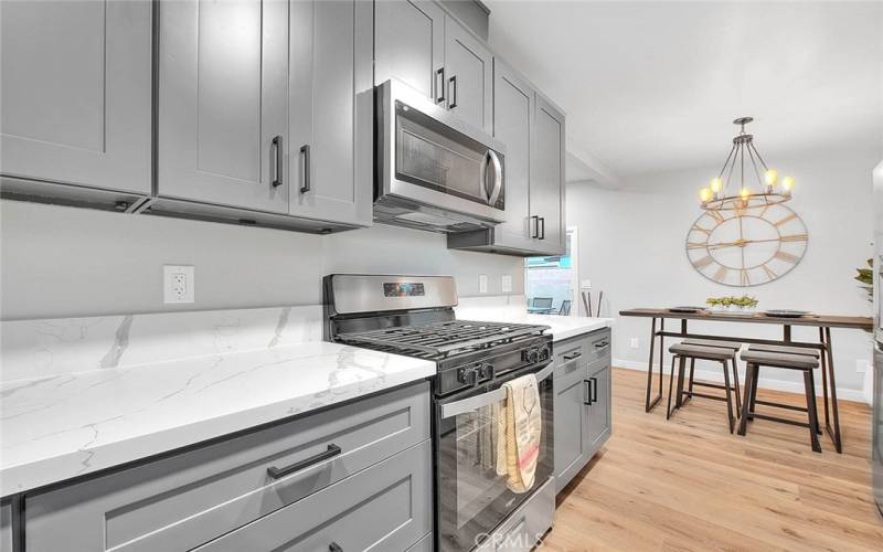 Brand New Kitchen: New Cabinetry, Quartz, and New Whirlpool Microwave and Stove.