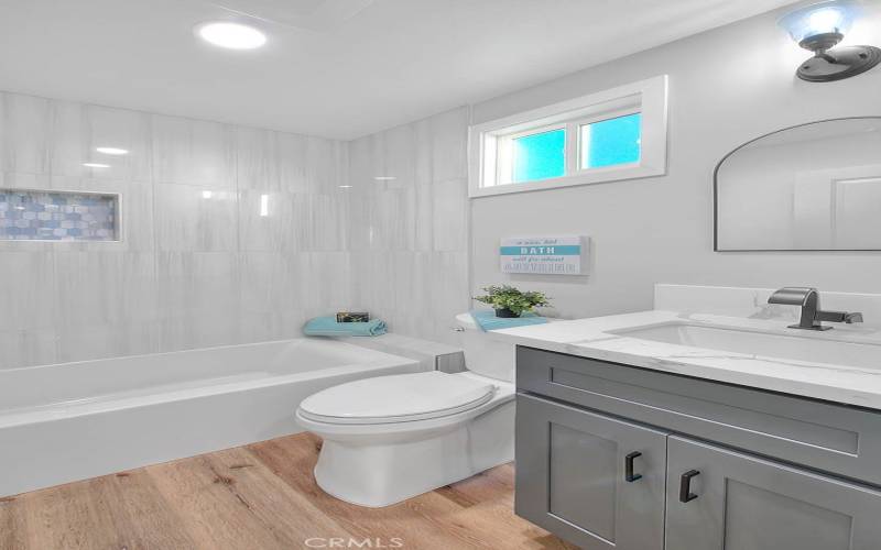 Primary Bathroom 1: Completely Remodeled w/New Dual Pane Windows. Kohler Fixtures, Kohler Toilet, and Koher Tub. Quartz Counter Top.