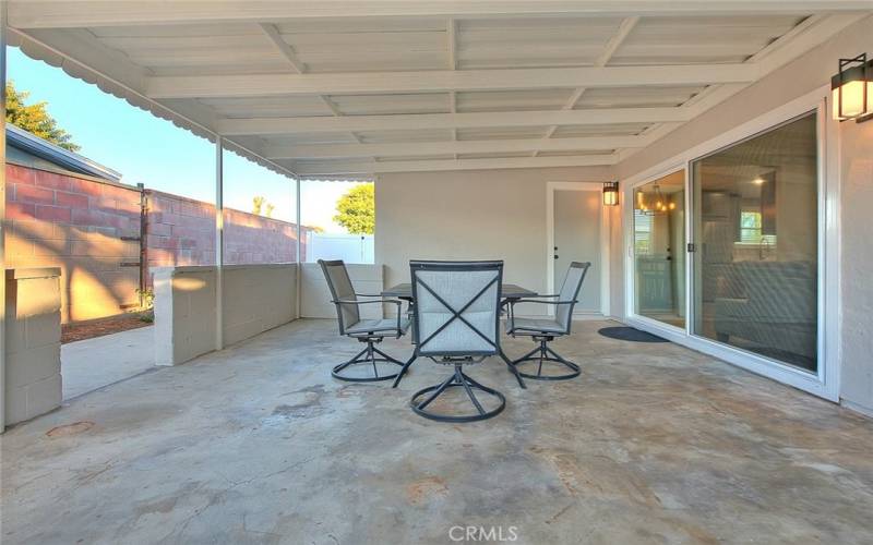 Covered Patio: Door Access to Garage. Glass sliding Door to Family Room.