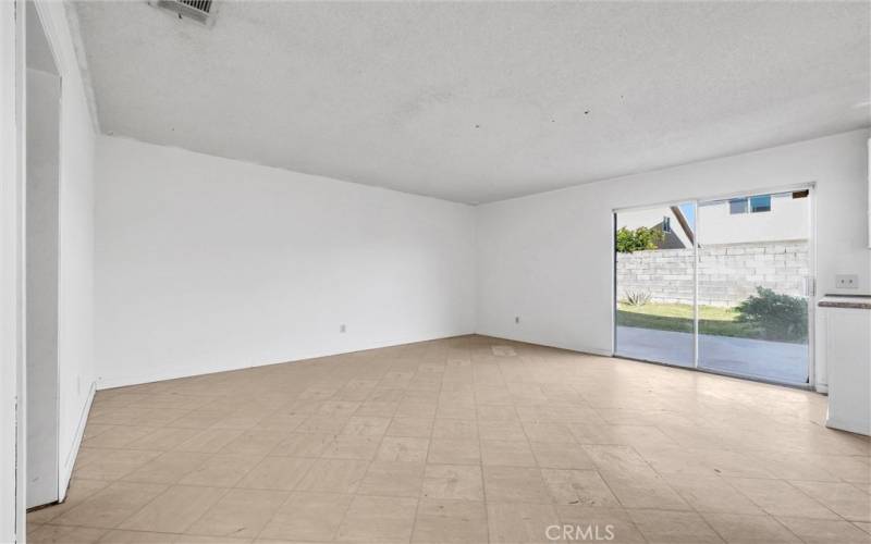 Family room next to the kitchen, sliding door leads to the back yard