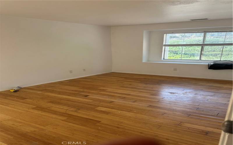 Hard wood floors in one of the bedrooms