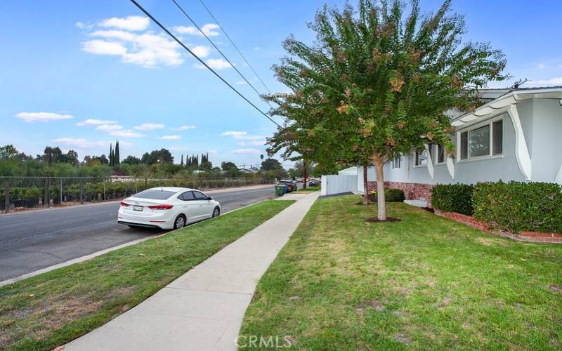 OFFERS THE POTENTIAL FOR AN ADU for multi-gen families, guests or additional income! TWO PRIMARY BEDROOMS! (One primary suite and one junior primary bedroom). GATED RV ACCESS AND PARKING. The brick and concrete pedestrian pathway that is flanked by colorful flowers, lush green grass, colorful raised brick planters, well-trimmed hedges, mature shade trees and a covered front porch enhance its eye-catching curb appeal.