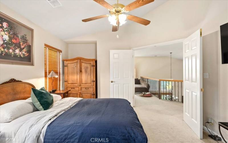 Master bedroom, doors open to the office/stairs to downstairs area