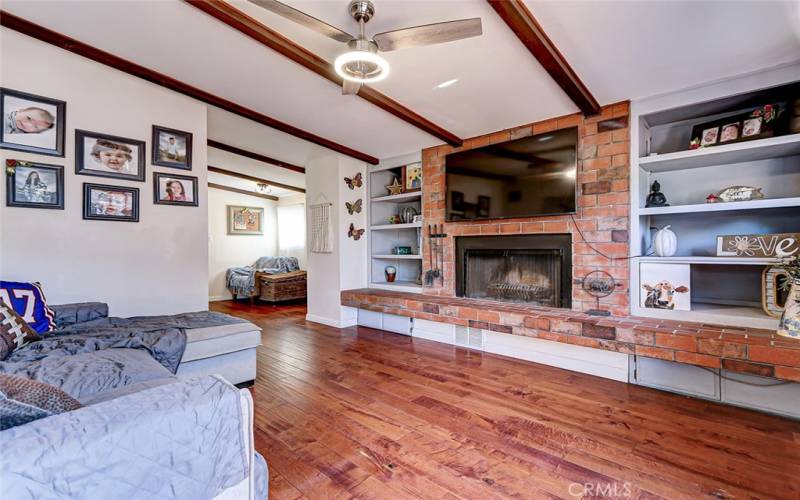 Cozy fireplace with built-in shelving for displaying books and decor