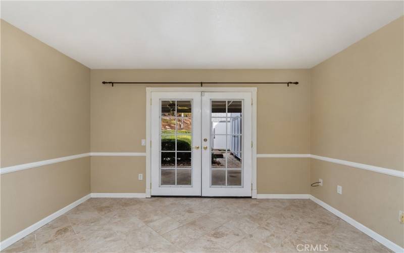 Downstairs Bedroom with French Doors to Backyard