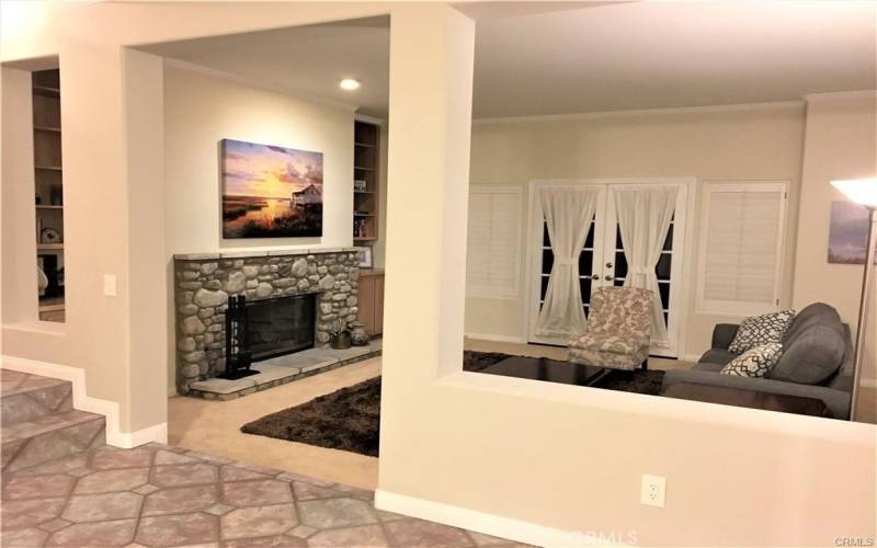 Living room with fireplace and sofa bed
