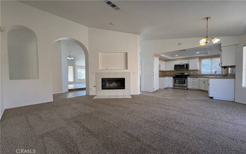 Family Room with Fireplace Open to the Kitchen