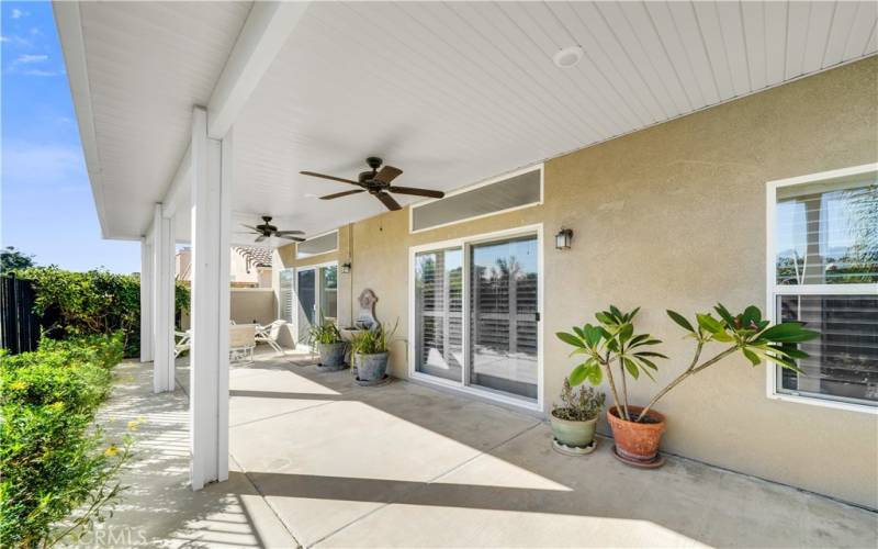 Beautiful patio cover with recessed lighting and ceiling fans