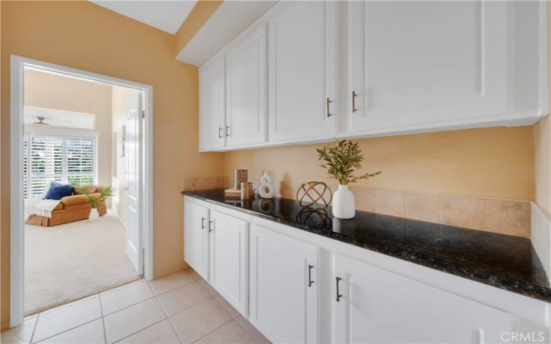 Hallway leading to the primary bedroom provides ample storage