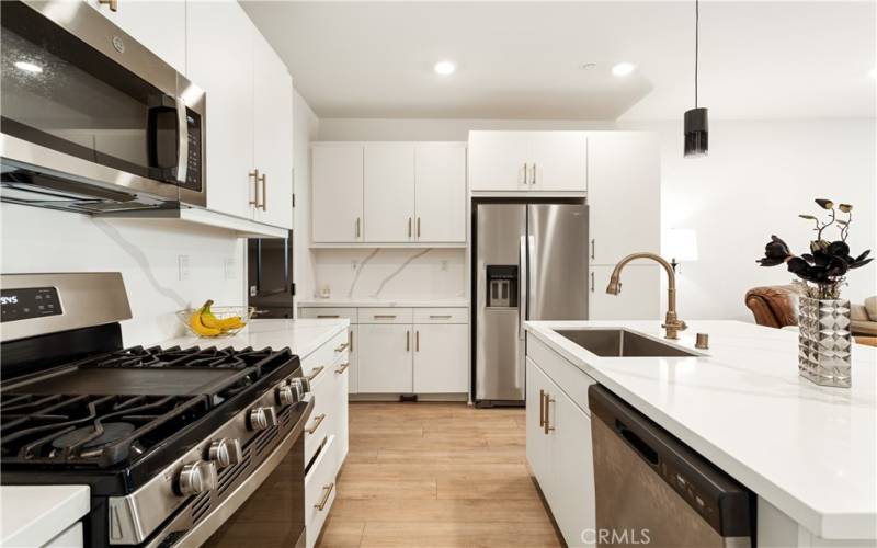 Trendy upgraded hardware and faucet makes this kitchen even more beautiful!