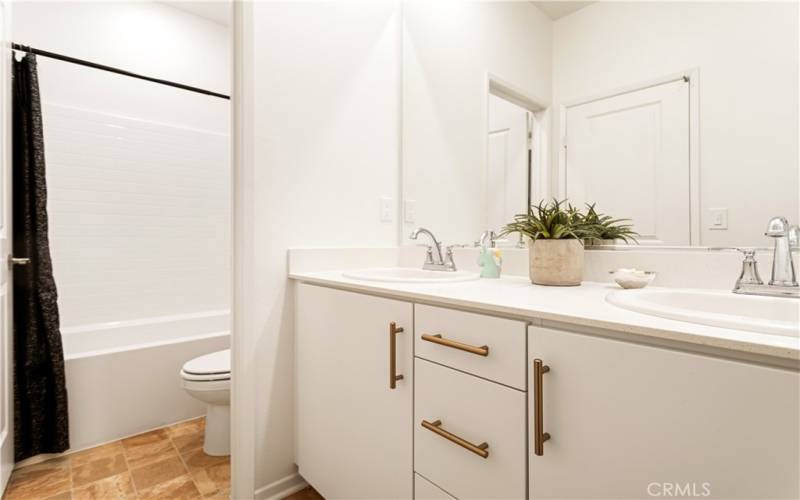 The upstairs hall bathroom is just beautiful. With the sink being separate, 2 people can be getting ready at the same time.