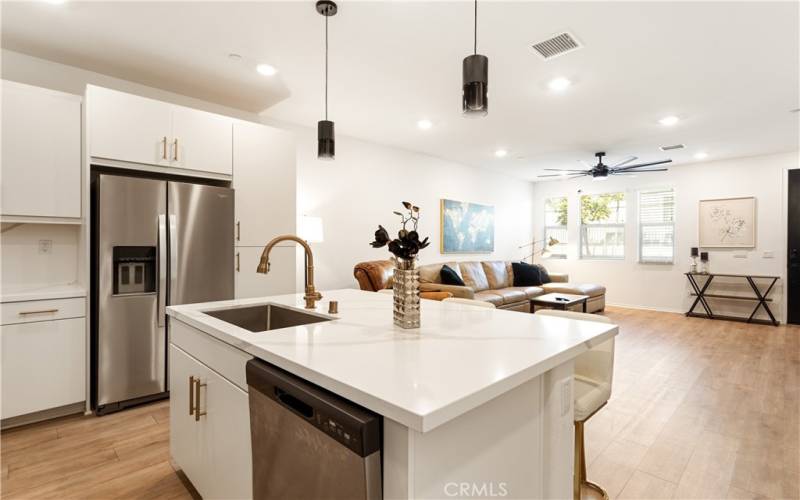 These upgraded countertops and drop-down lighting make quite a statement.