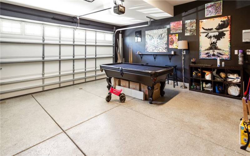 The seller has turned the garage into a game area, and there is still plenty of room to park. Pool table and accessories are negotiable.