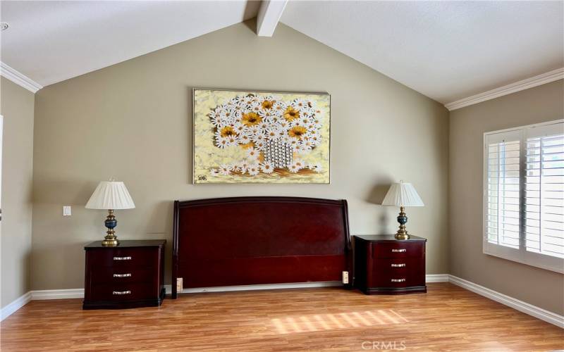 Primary Bedroom with Vaulted Ceilings, Laminate Flooring and Plantation Shutters!