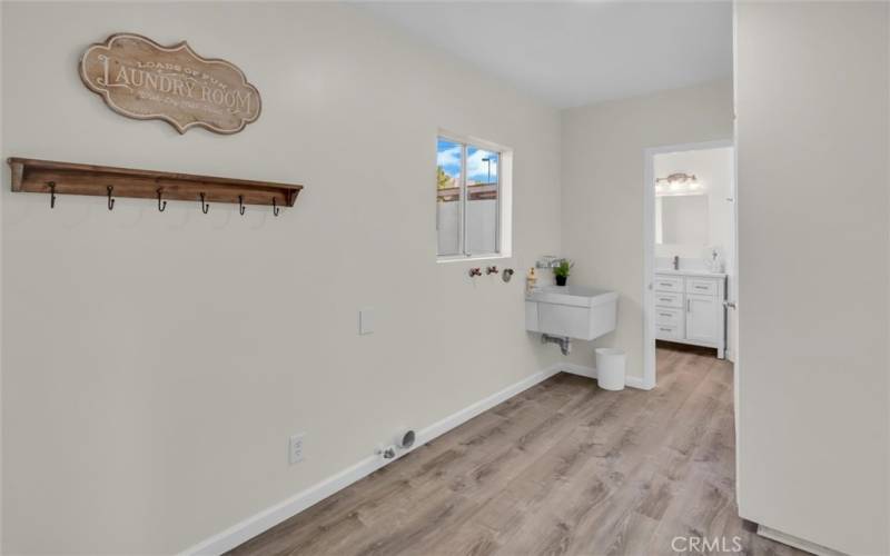 Very spacious laundry/mud room right off of the garage door.  Tons more storage in the cabinet to the right of this picture