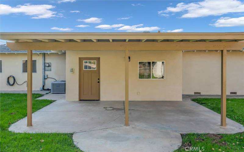 Covered back concrete patio