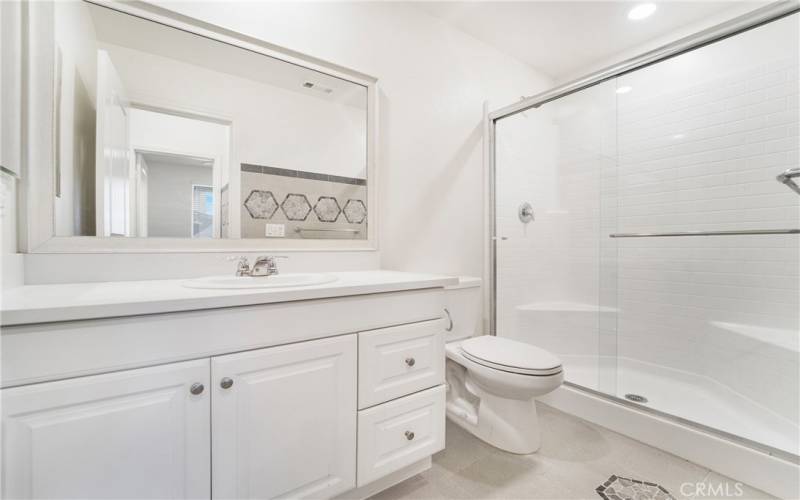 Downstairs bathroom offers lots of designer touches. Enjoy upgraded tile work and countertops.