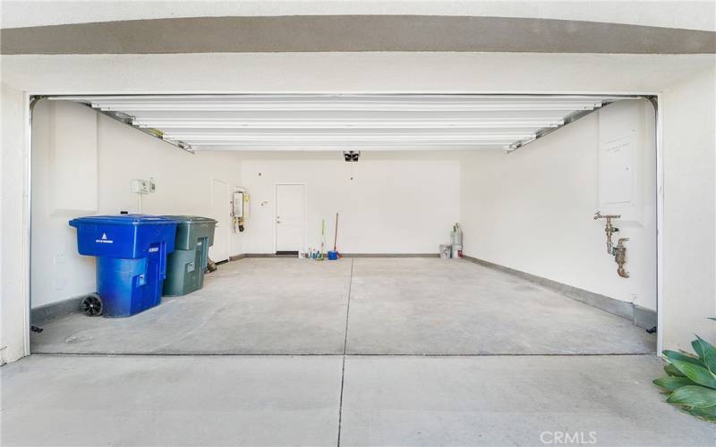 Fully finished, two-car garage. Note the extra space bc of the tankless water heater!