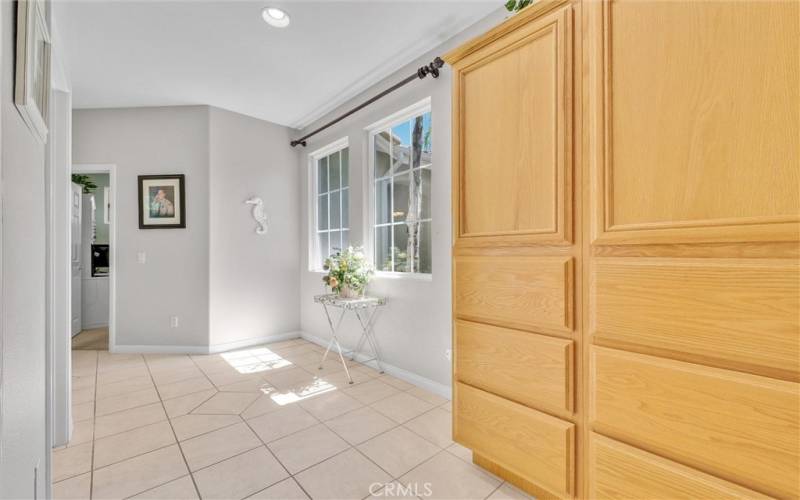 Spacious hallway with storage cabinets leading to additional 3 bedrooms.