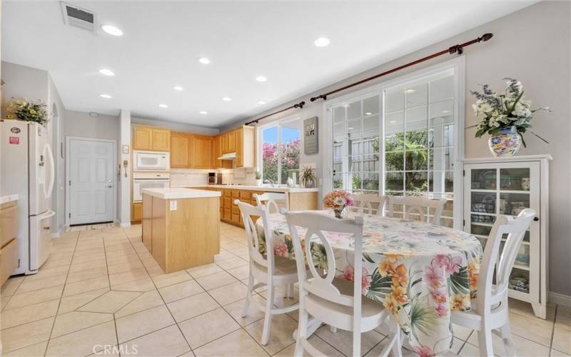 Dining area with slider that leads to patio.