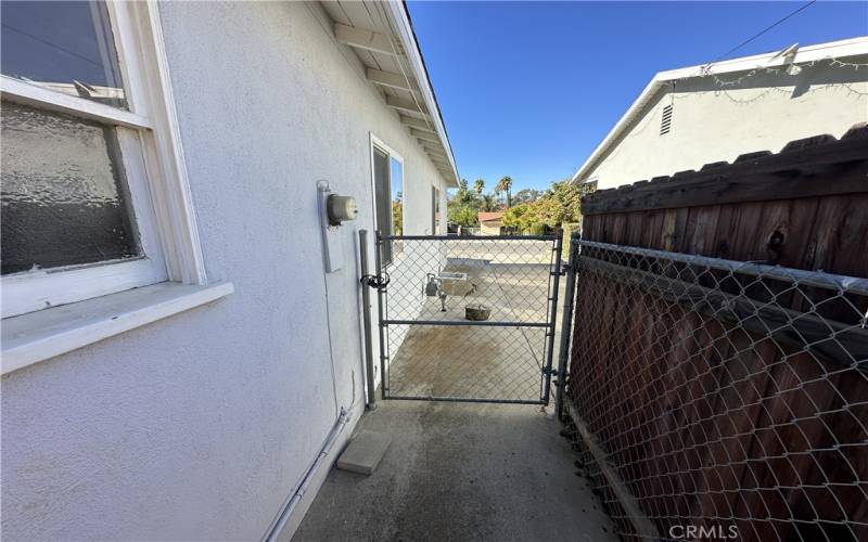 Man gate on the left of the home.