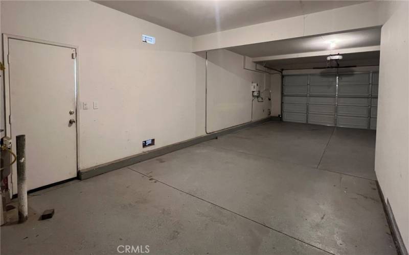 3 car tandem garage. Door is 2 cars wide, one car spot is two cars deep.