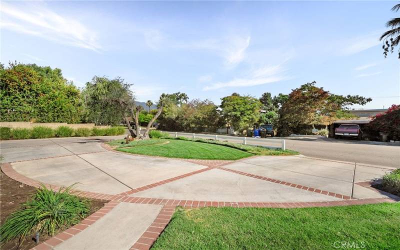 Huge circular driveway with brick inlays.