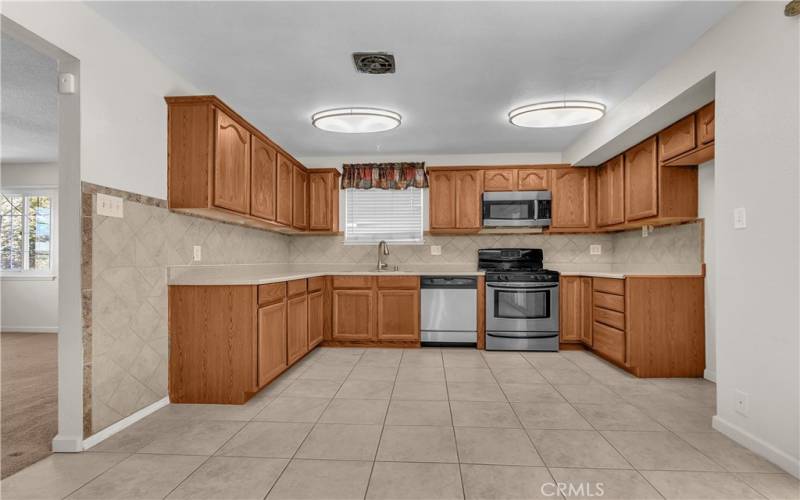 Kitchen with stove and microwave