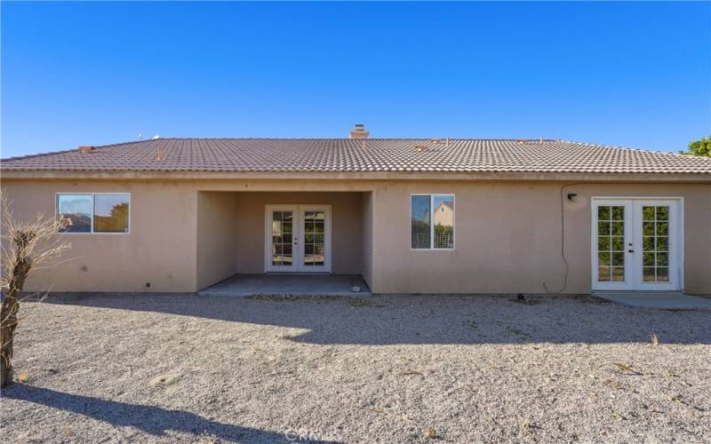 Backyard with shaded area outside family room