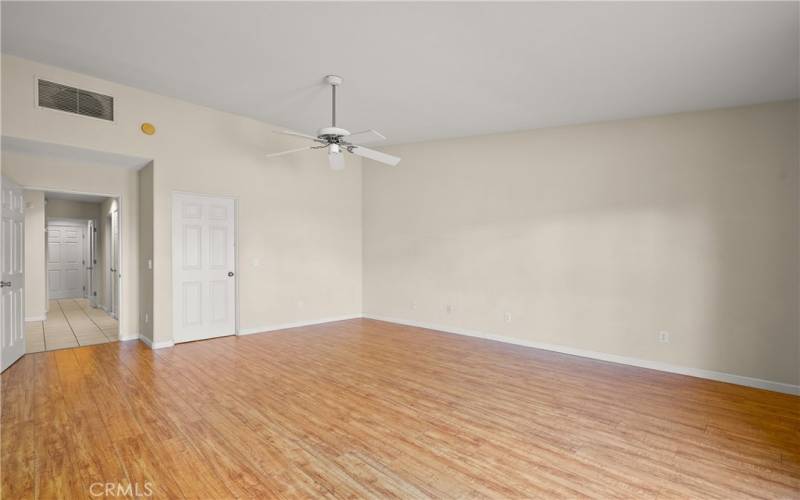 Large primary bedroom has space & lots of closets