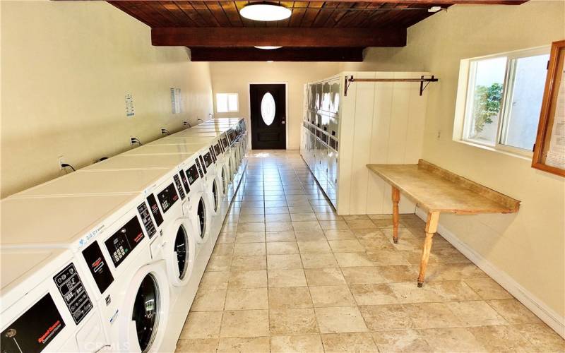 One of several laundry rooms; this one is ideally located close to the unit