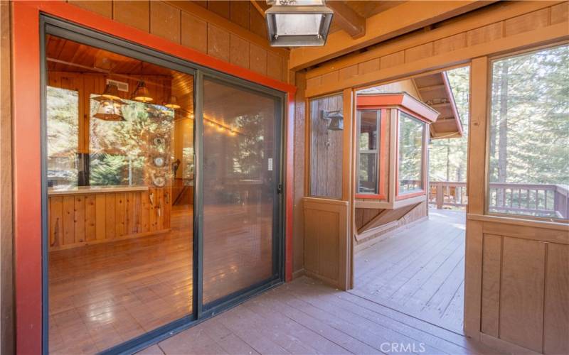 Screened outdoor sunroom.