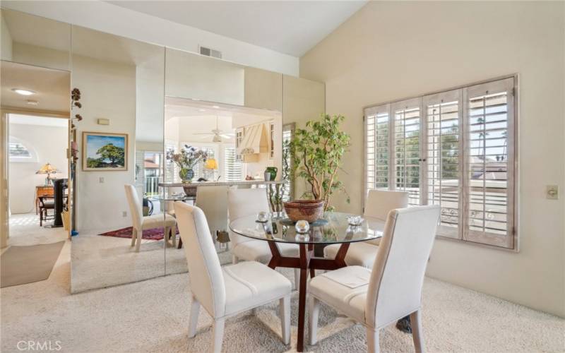 Dining area with pass-thru window to the kitchen.  So much lovely natural light.