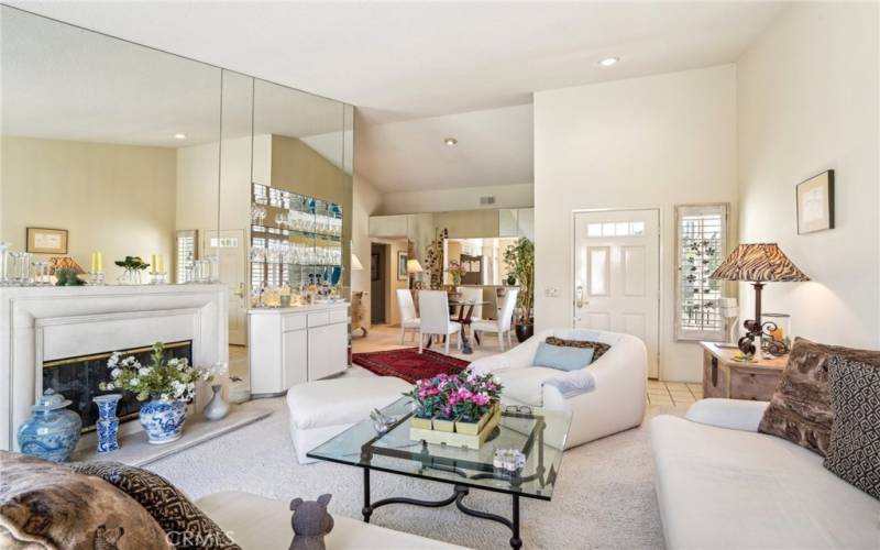 This view of the space shows how it seamlessly flows into the dining area.  Notice the beautiful mirrored wet-bar.