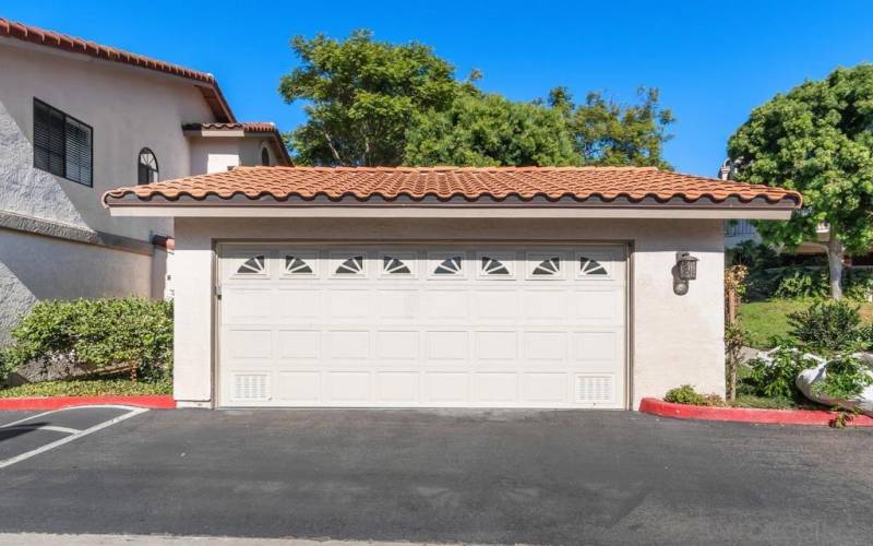 Detached 2 car garage with ample storage. Short walk to unit. New epoxy floors.