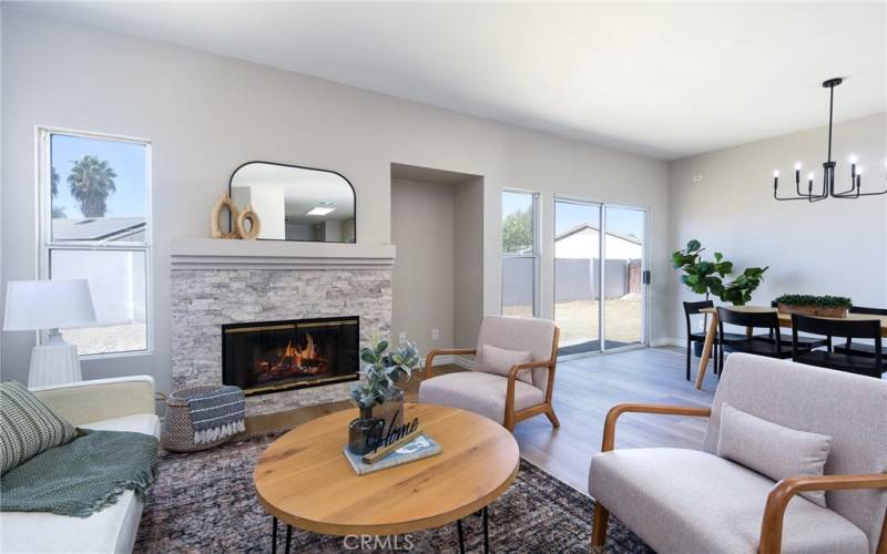 Refreshed gas fireplace with stacked stone surround