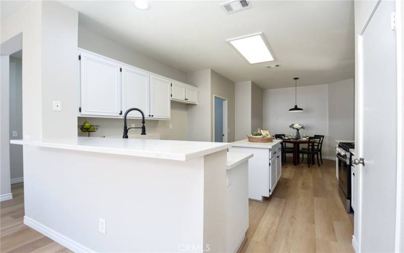 Kitchen has a bar top for easy hosting