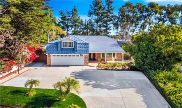 Laguna Hills Home with ample driveway, plus gated RV parking.