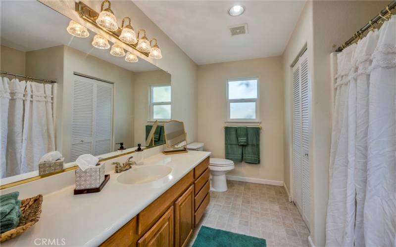 Hall bath with shower over tub