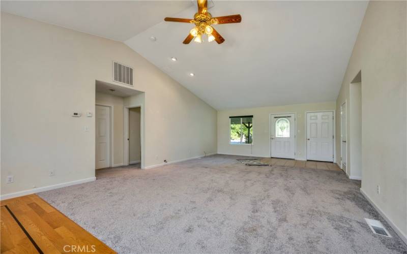 Open living area with vaulted ceiling