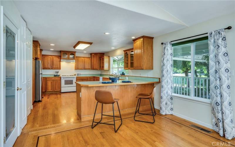 Open kitchen has tons of counter space and cabinets