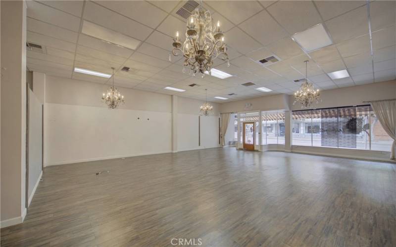 Interior of lease space with art hanging rails and stunning chandeliers