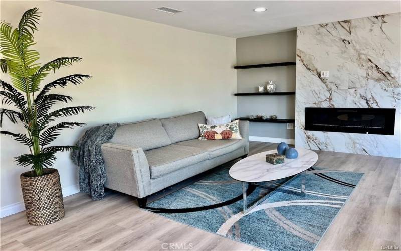 Expansive living room with fireplace.